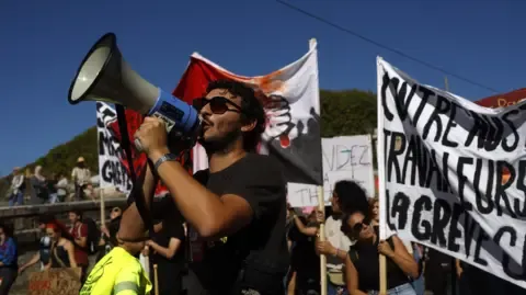Countrywide Walkouts Erupt Against Spending Cuts
